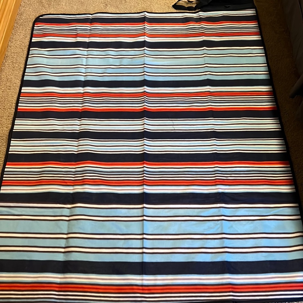 Outdoor blanket with built in removable speakers